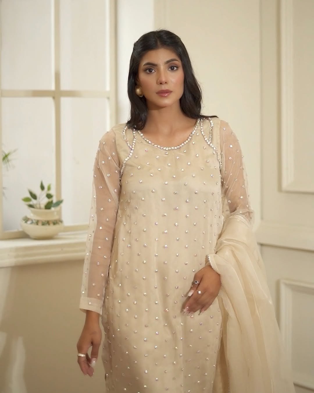 𝗕𝗲𝗶𝗴𝗲Grace meets elegance in this beige organza dress, adorned with shimmering handworked crystal flowers. A timeless winter masterpiece for your most graceful moments..Now available in store - https---vogueco